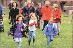 Youngsters run off at the start of the fun run