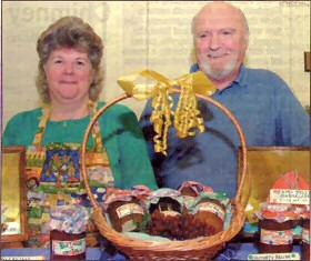 HALL SUPPORTERS: Lesley and Dave Winney offer handicrafts and preserves at the sale. Picture by Sonia McDuff
