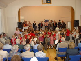 School children sing and play