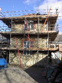 Repointing stonework on tower block